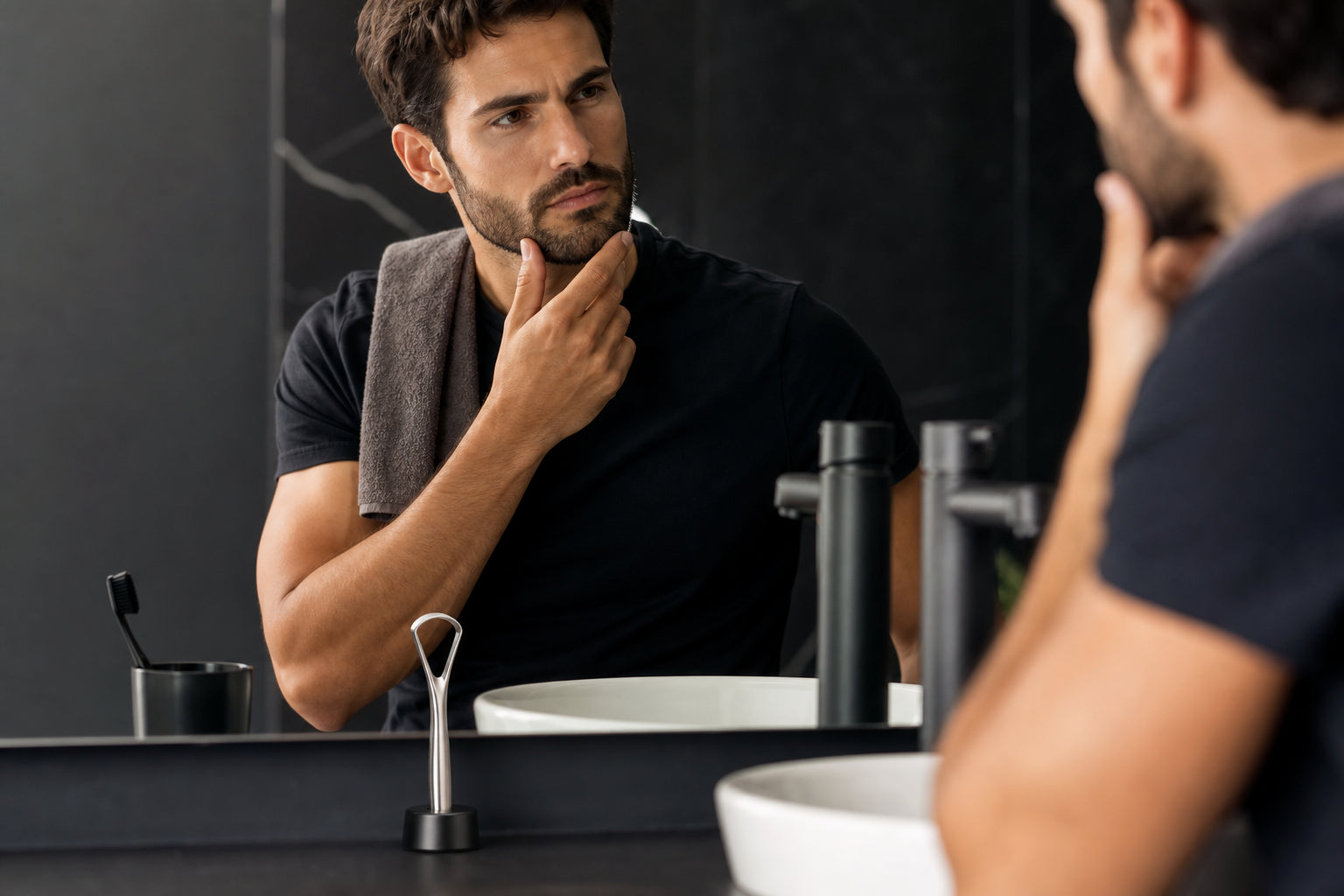 Tongue cleaner beside a minimalist sink in a modern grooming routine